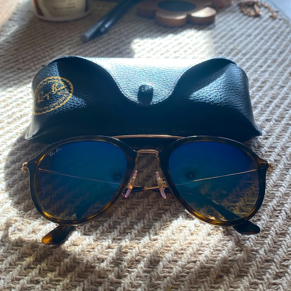 Ray Ban, double-bridge, tortoise rim, golden accents, blue-radiant shades.